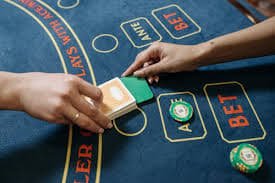 Filipino sports betting player reviewing m203 odds on smartphone